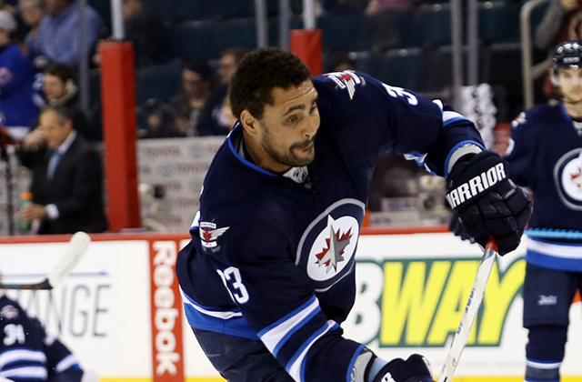 Dustin Byfuglien wasn't penalized for his cross-check. (Bruce Fedyck, USA TODAY Sports)