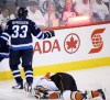 Dustin Byfuglien shoves Corey Perry to the ice. (Bruce Fedyk, USA TODAY Sports)