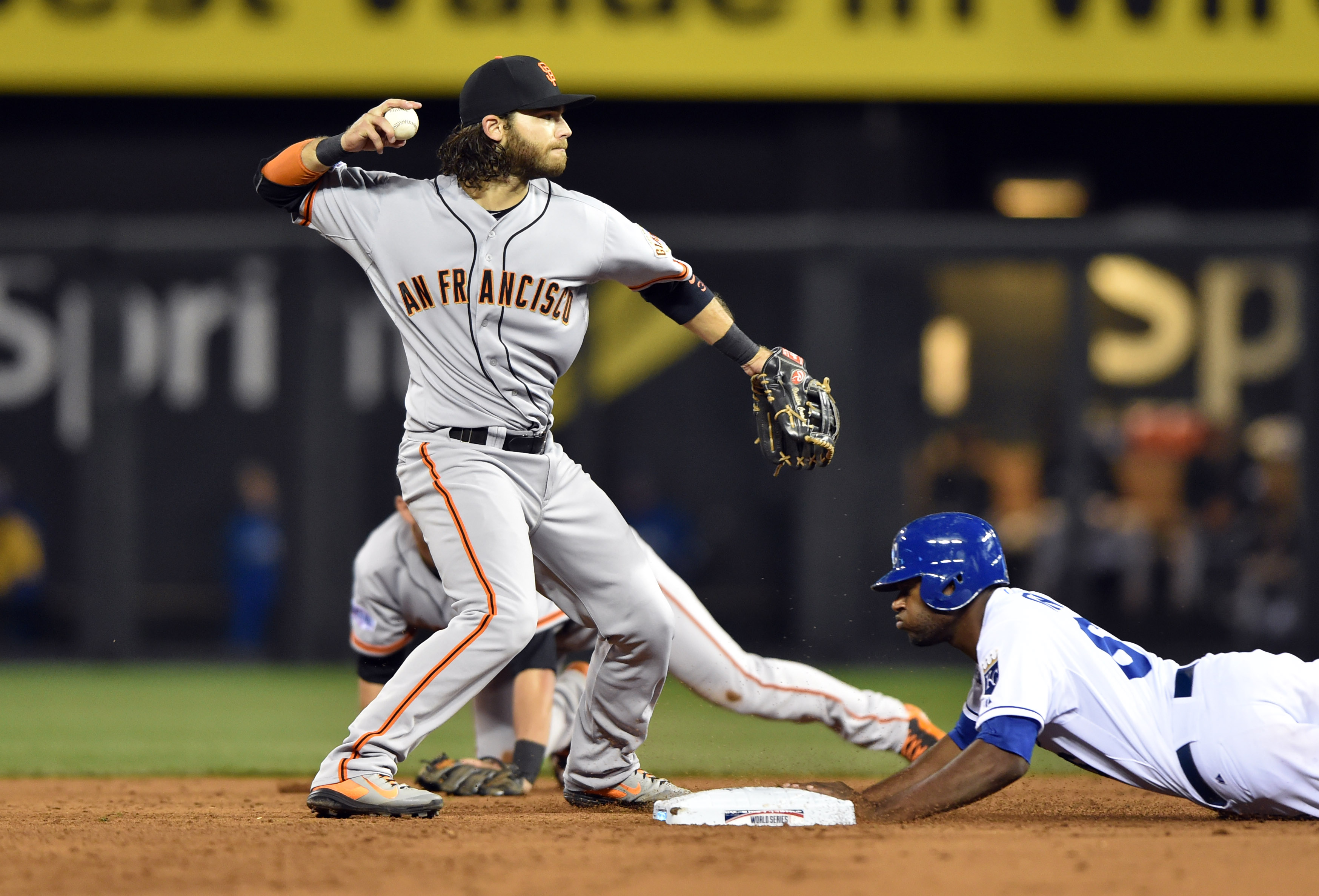 Giants shortstop Brandon Crawford turns a double play during the 2014 World Series. (USA TODAY Sports Images)
