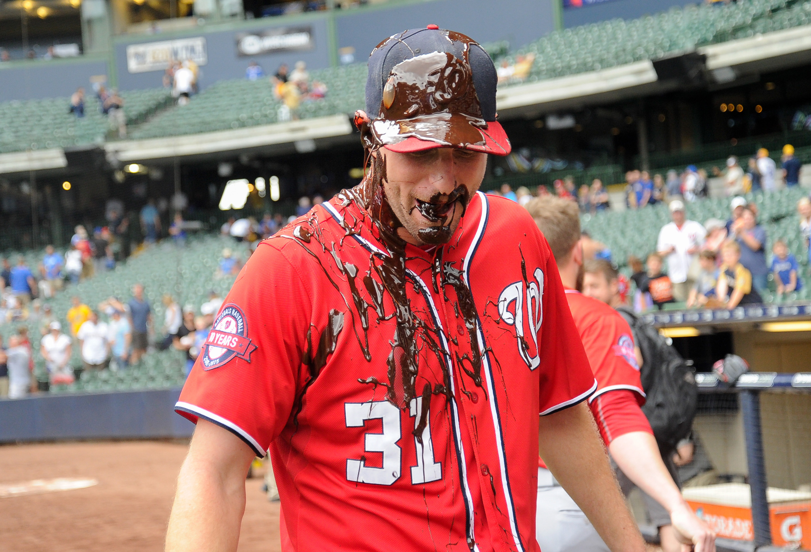 Washington Nationals Max Scherzer can only smile as he is drenched in  celebratory chocolate syrup after pitching a no-hitter against the  Pittsburgh Pirates at Nationals Park on June 20, 2015 in Washington