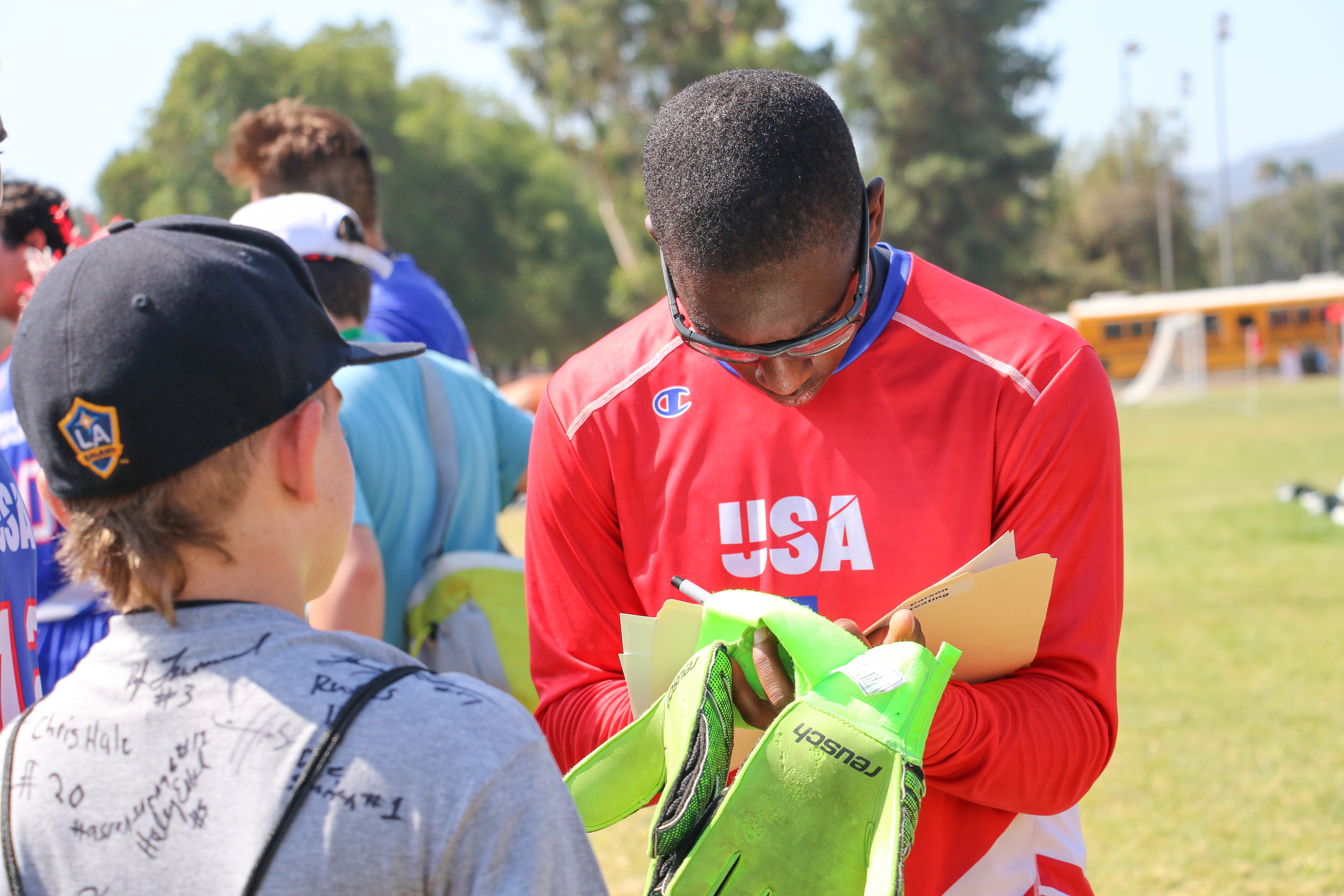Ordray Smith signs autographs for fans at the World Games (Aaron Mills/Special Olympics USA)