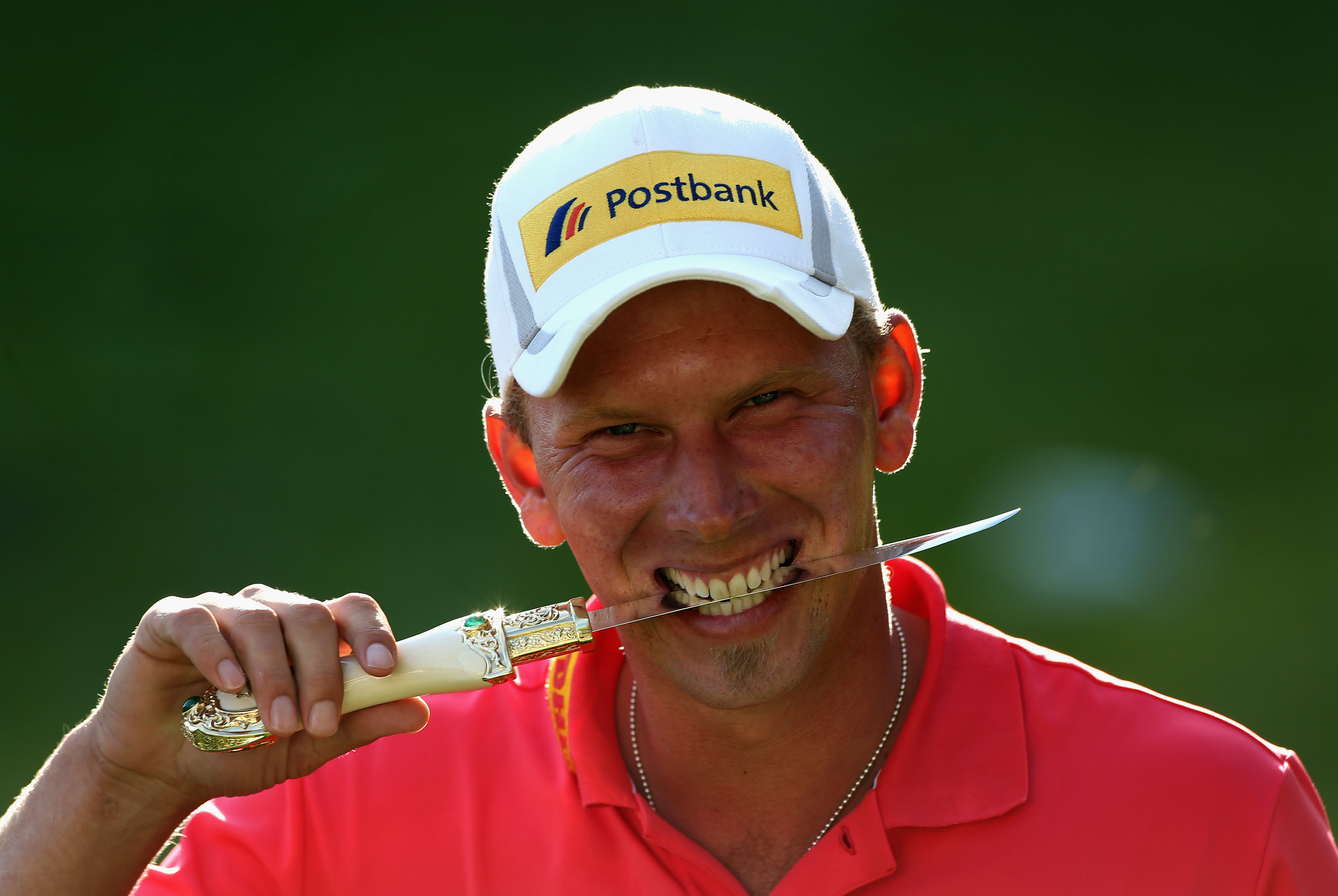 AGADIR, MOROCCO - MARCH 31: Marcel Siem of Germany poses with the trophy dagger after winning the Trophee du Hassan II Golf on a score of -17 under par at Golf du Palais Royal on March 31, 2013 in Agadir, Morocco. (Photo by Warren Little/Getty Images) ORG XMIT: 157993387 ORIG FILE ID: 165122545
