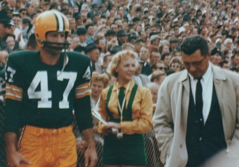 A Green Bay Packers cheerleader is seen before an NFL football