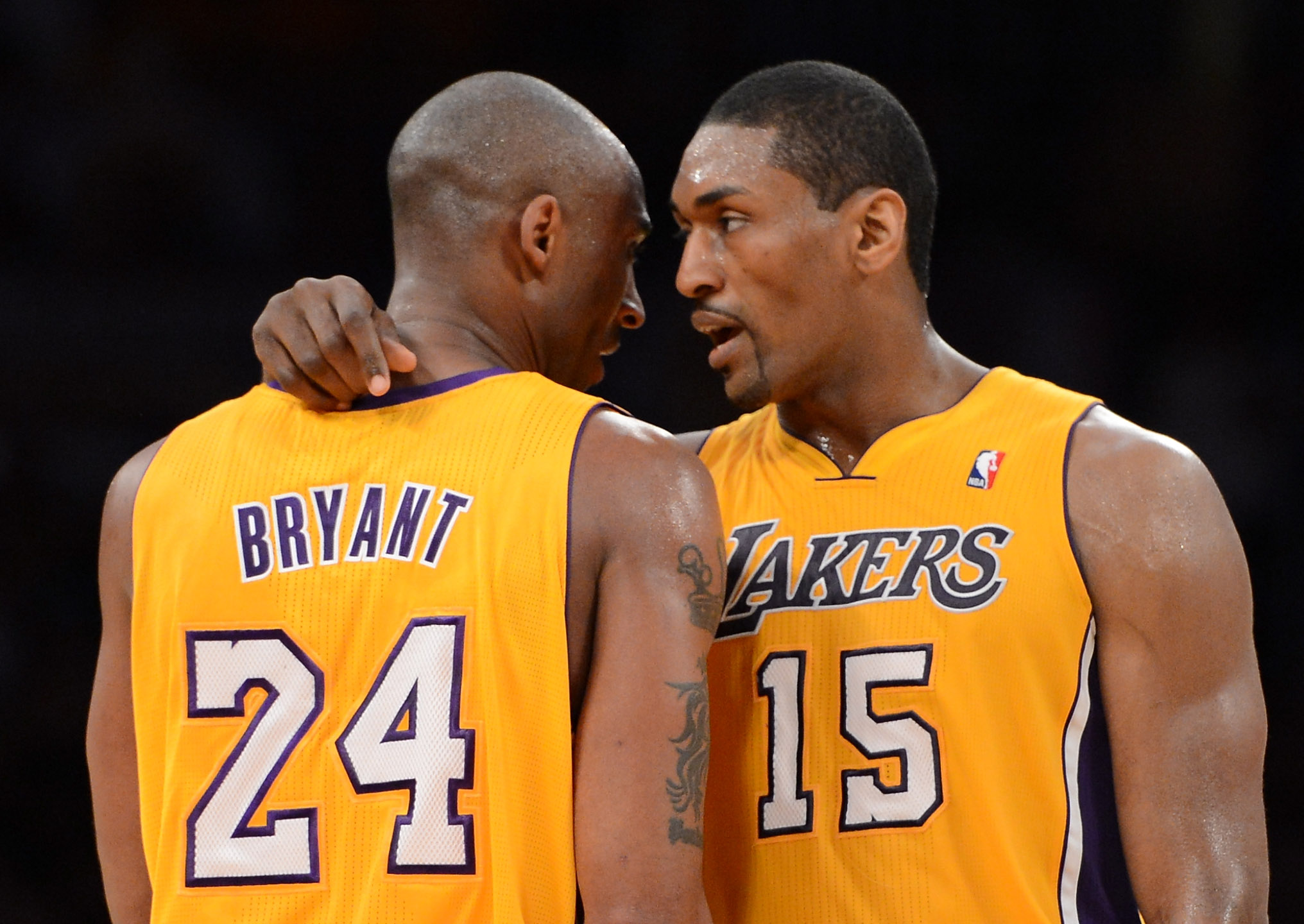 ORG XMIT: 143577168 LOS ANGELES, CA - MAY 12:  Kobe Bryant #24 of the Los Angeles Lakers talks with teammate Metta World Peace #15 in the second quarter while taking on the Denver Nuggets in Game Seven of the Western Conference Quarterfinals in the 2012 NBA Playoffs on May 12, 2012 at Staples Center in Los Angeles, California. NOTE TO USER: User expressly acknowledges and agrees that, by downloading and or using this photograph, User is consenting to the terms and conditions of the Getty Images License Agreement.  (Photo by Harry How/Getty Images) ORIG FILE ID: 144264195