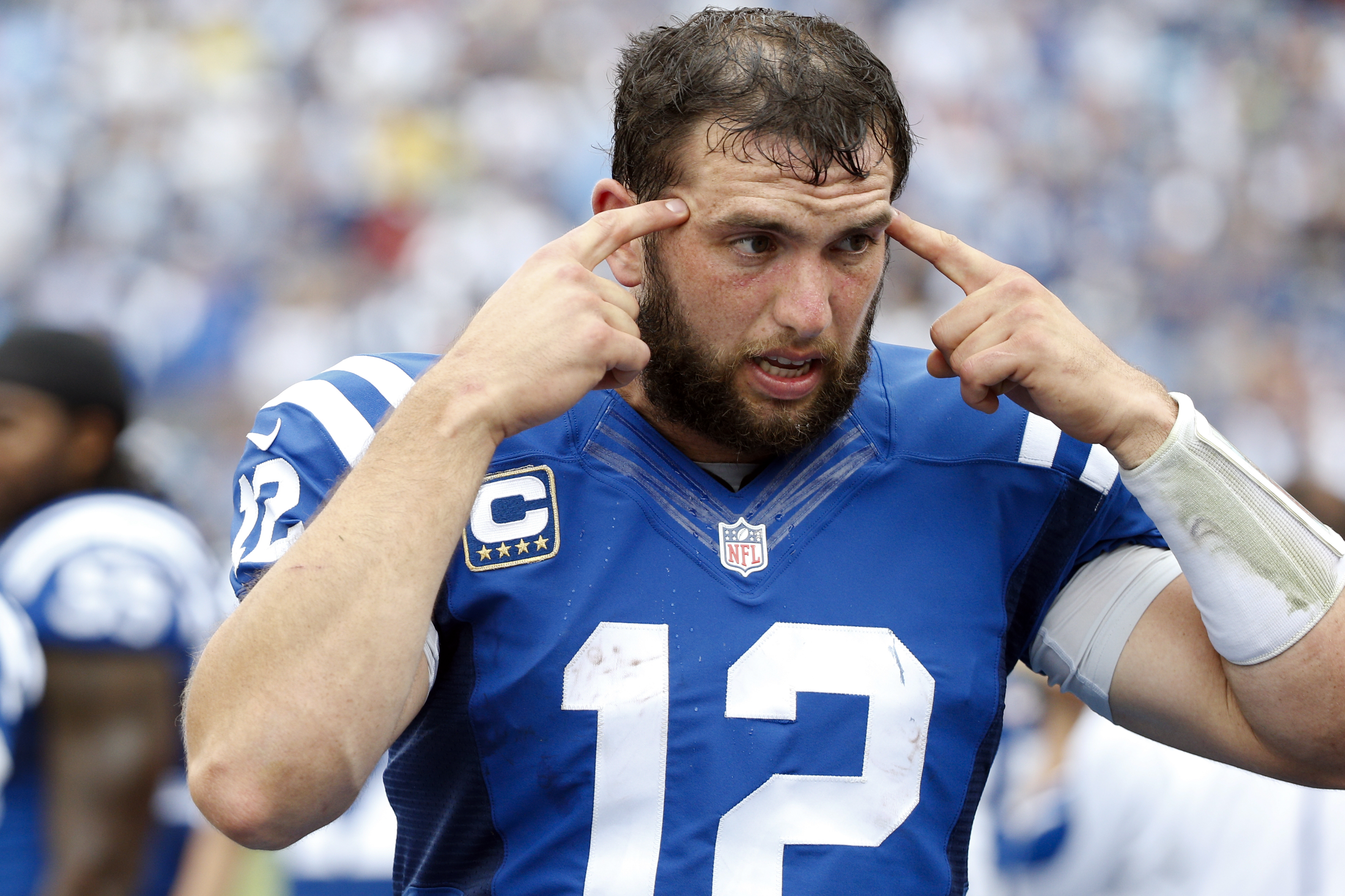 Andrew Luck shows Matt Hasselbeck how he draws defenders offside