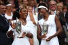 LONDON, ENGLAND - JULY 09: Venus Williams of The United States and Serena Williams of The United States hold their trophies following victory in the Ladies Doubles Final against Timea Babos of Hungary and Yaroslava Shvedova of Kazakhstan on day twelve of the Wimbledon Lawn Tennis Championships at the All England Lawn Tennis and Croquet Club on July 9, 2016 in London, England. (Photo by Clive Brunskill/Getty Images) ORG XMIT: 596729271 ORIG FILE ID: 545701954