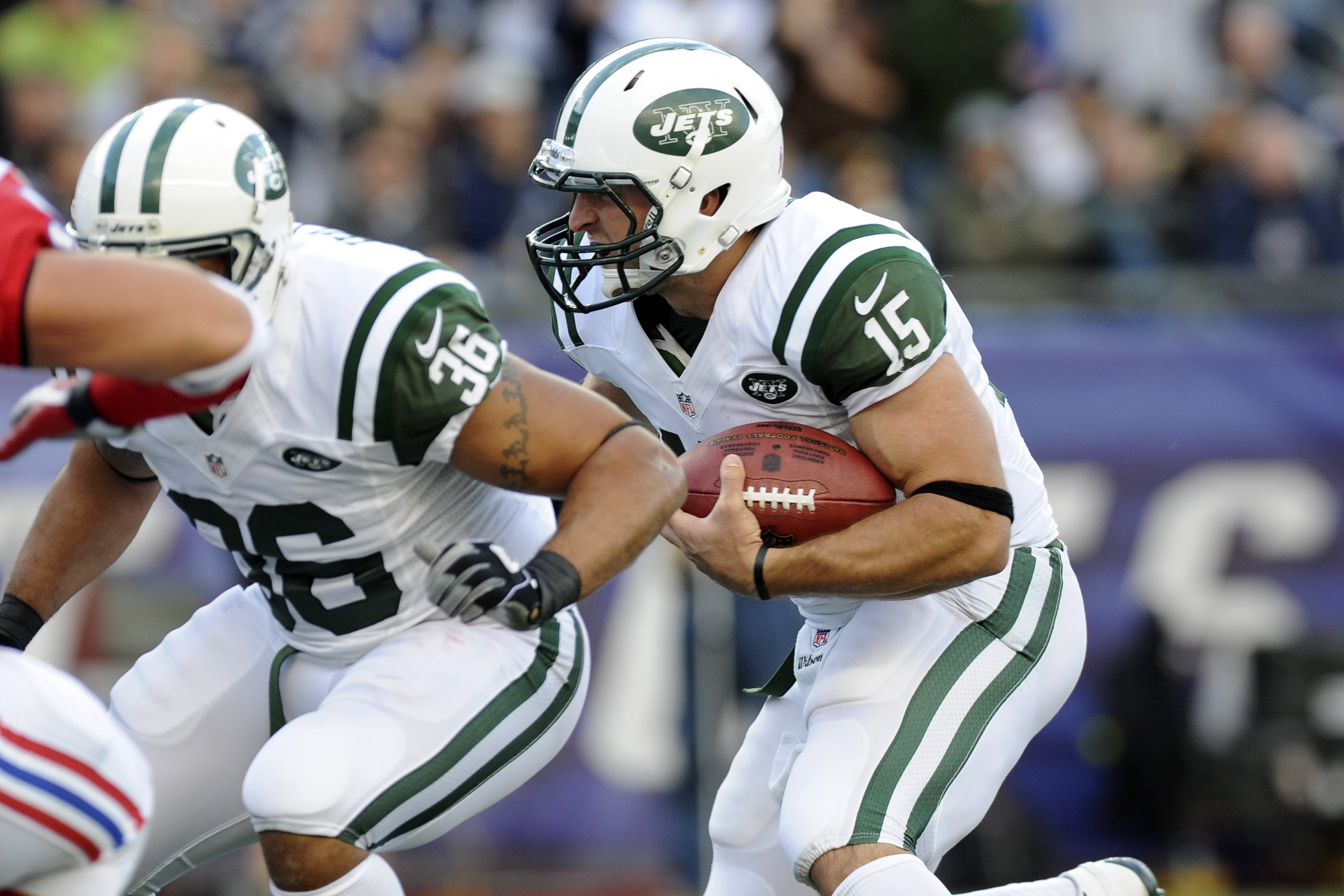 October 21, 2012; Foxboro, MA USA; New York Jets quarterback Tim Tebow (15) runs with the ball during the first quarter against the New England Patriots at Gillette Stadium. Mandatory Credit: Bob DeChiara-US PRESSWIRE ORG XMIT: USPW-81936 ORIG FILE ID: 20121021_jrc_ad7_166.JPG