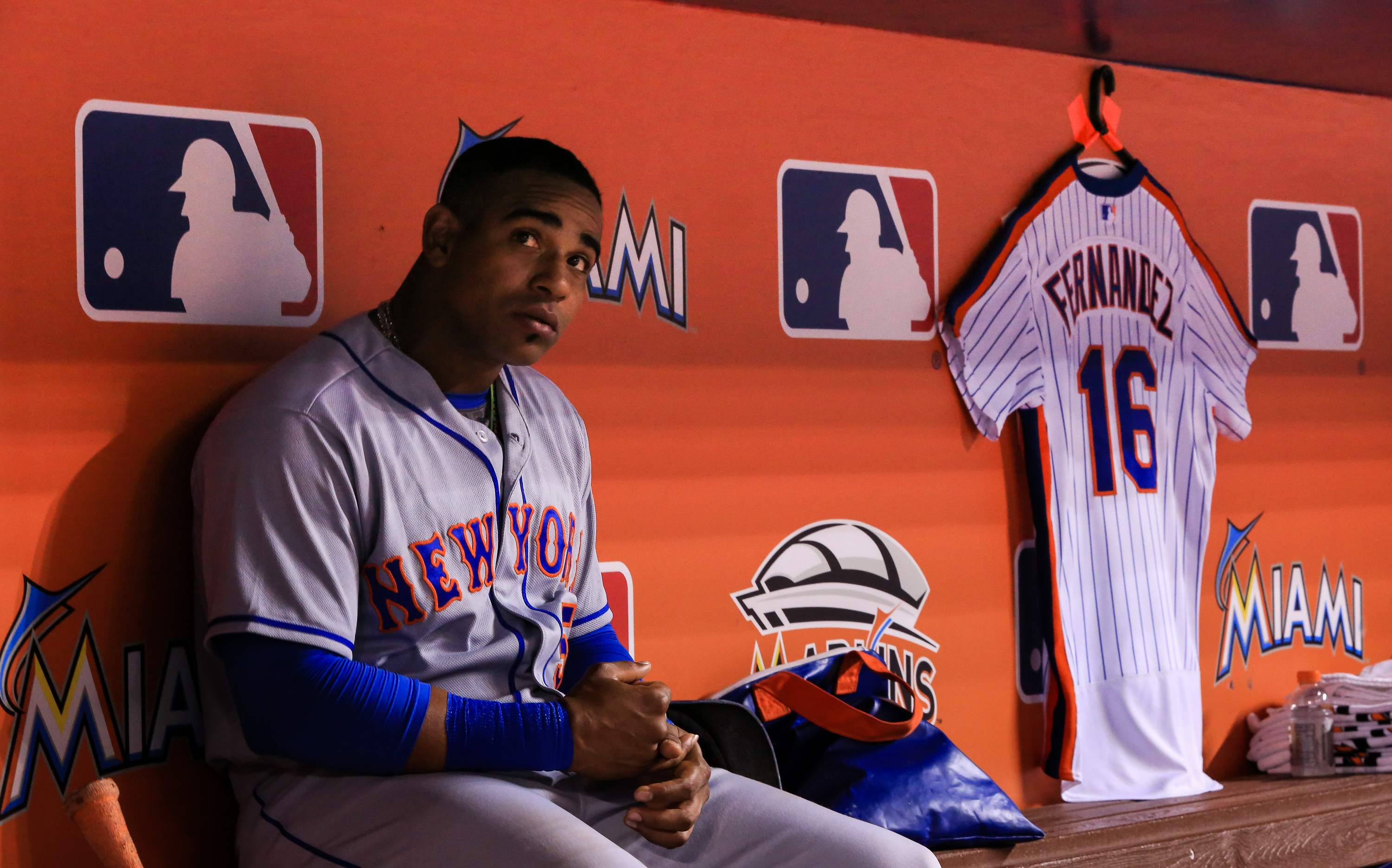 MIAMI, FL - SEPTEMBER 26: Yoenis Cespedes #52 of the New York Mets looks on from the dugout where he had hung a Jose Fernandez jersey in honor of the late pitcher during the game against the Miami Marlins at Marlins Park on September 26, 2016 in Miami, Florida. (Photo by Rob Foldy/Getty Images) ORG XMIT: 607685695 ORIG FILE ID: 610610546