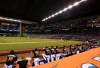 MIAMI, FL - SEPTEMBER 26: Miami Marlins players look on from the dugout wearing Jose Fernandez jerseys in honor of the late pitcher during the game against the New York Mets at Marlins Park on September 26, 2016 in Miami, Florida. (Photo by Rob Foldy/Getty Images) ORG XMIT: 607685695 ORIG FILE ID: 610611602
