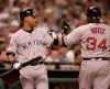 July 13, 2004 -- Houston, TX -- Minute Maid Park -- All-Star Game -- Derek Jeter congratulates David Ortiz after Ortiz scored on a triple by Alex Rodriquez in the 4th inning . (Via MerlinFTP Drop)
