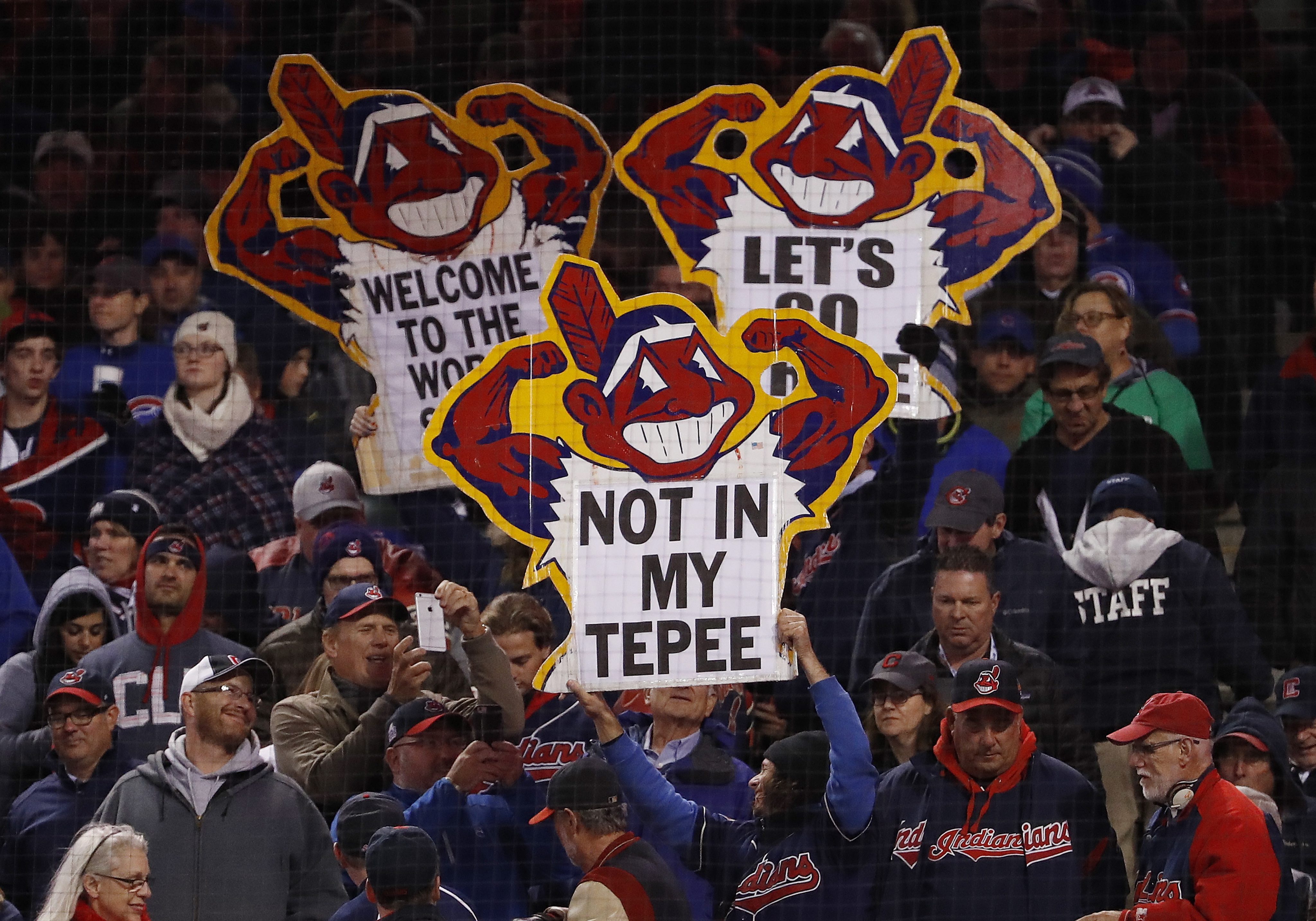 epa05603081 Cleveland Indians fans hold up signs in the top of the eighth inning of game one of the World Series between the Chicago Cubs and the Cleveland Indians at Progressive Field in Cleveland, Ohio, USA, 25 October 2016. The best-of-seven series will be played with games first in Cleveland, then Chicago and back to Cleveland if necessary. EPA/JOHN G. MABANGLO ORG XMIT: MCX019