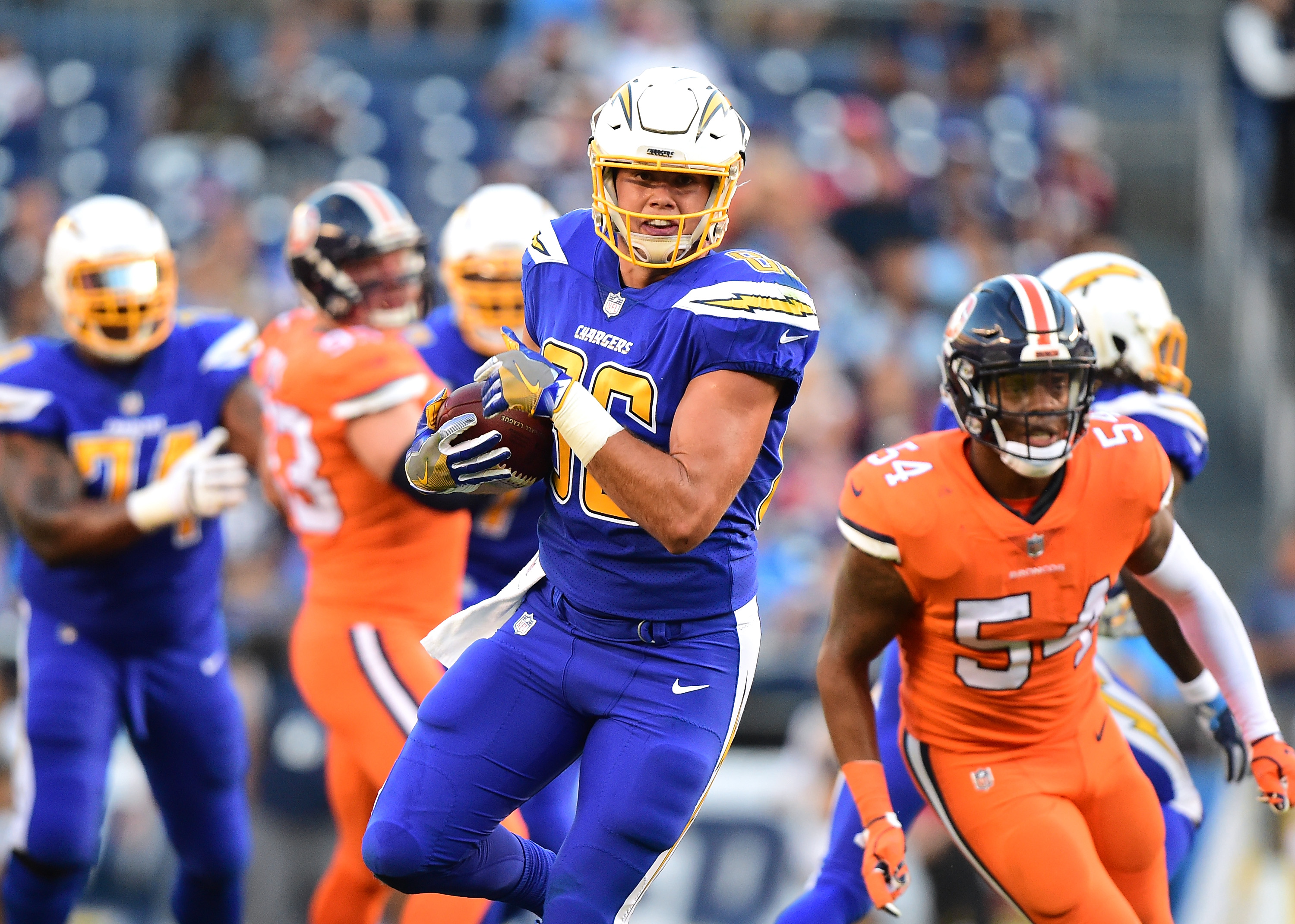 LOOK: Broncos, Chargers unveil sweet helmets for Color Rush game