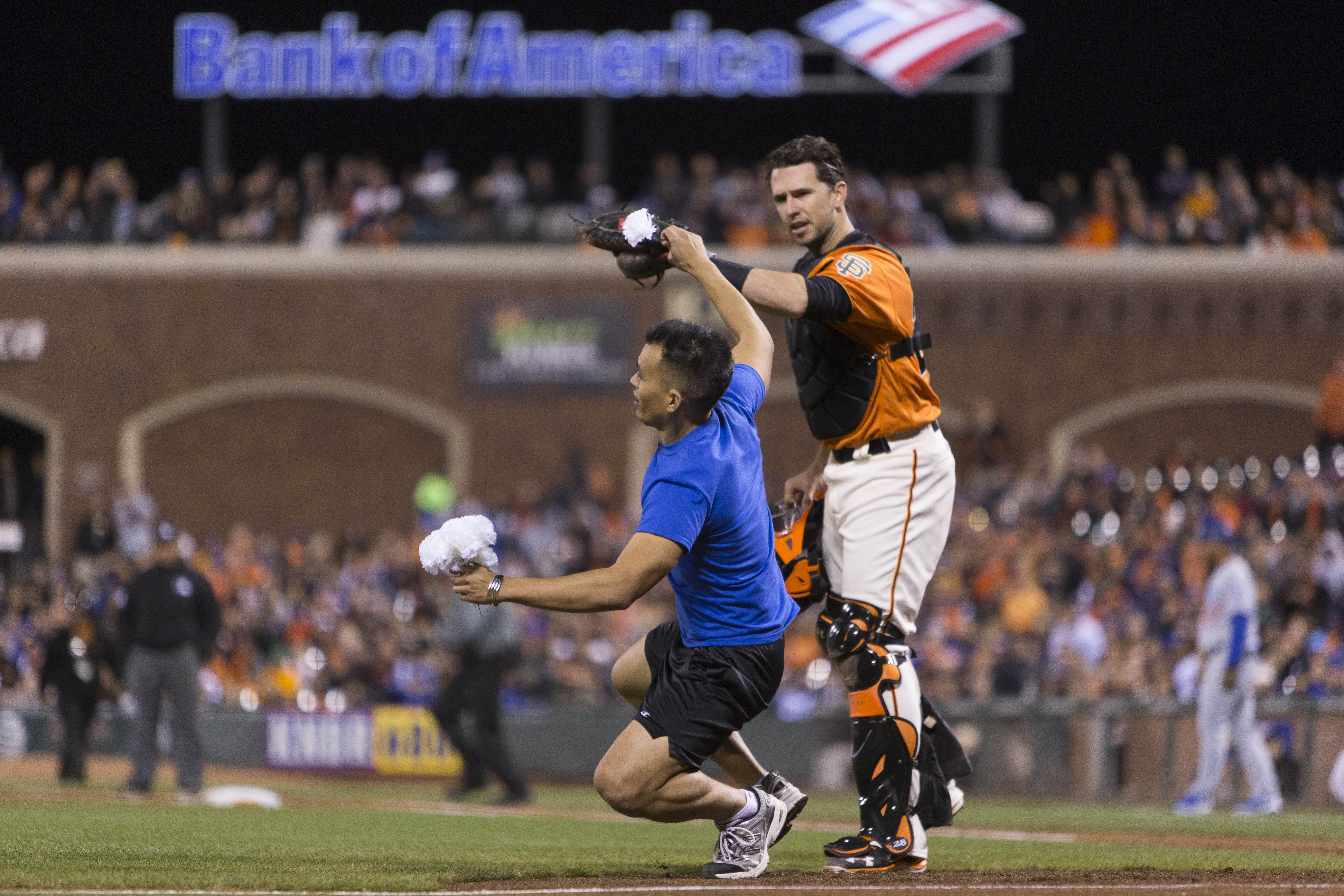 Sep 30, 2016; San Francisco, CA, USA;  San Francisco Giants catcher Buster Posey (28) pushes a fan away during the fourth inning against the Los Angeles Dodgers  at AT&T Park. Mandatory Credit: Neville E. Guard-USA TODAY Sports ORG XMIT: USATSI-263050 ORIG FILE ID:  20160930_lbm_gb9_190.JPG
