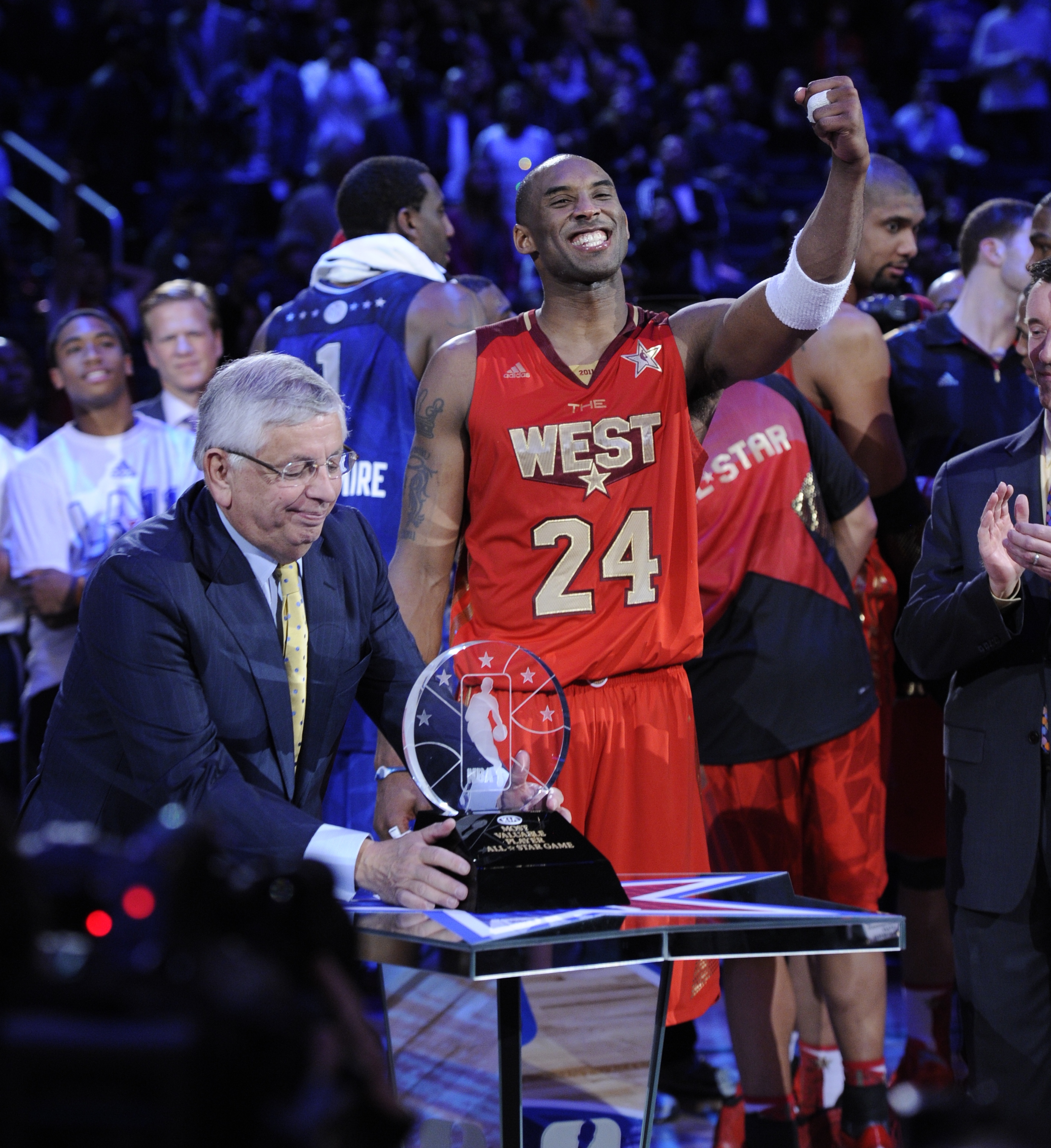 ORG XMIT: RH 39583 NBA All Star 2/19/2011  2/20/11 9:34:48 -- Los Angeles, CA, U.S.A  -- Kobe Bryant celebrates being awarded the MVP trophy by NBA commissioner David Stern  during the 2011 NBA All Star Game at Staples Center in Los Angeles, CA --    Photo by Robert Hanashiro, USA TODAY Staff  (Via OlyDrop)