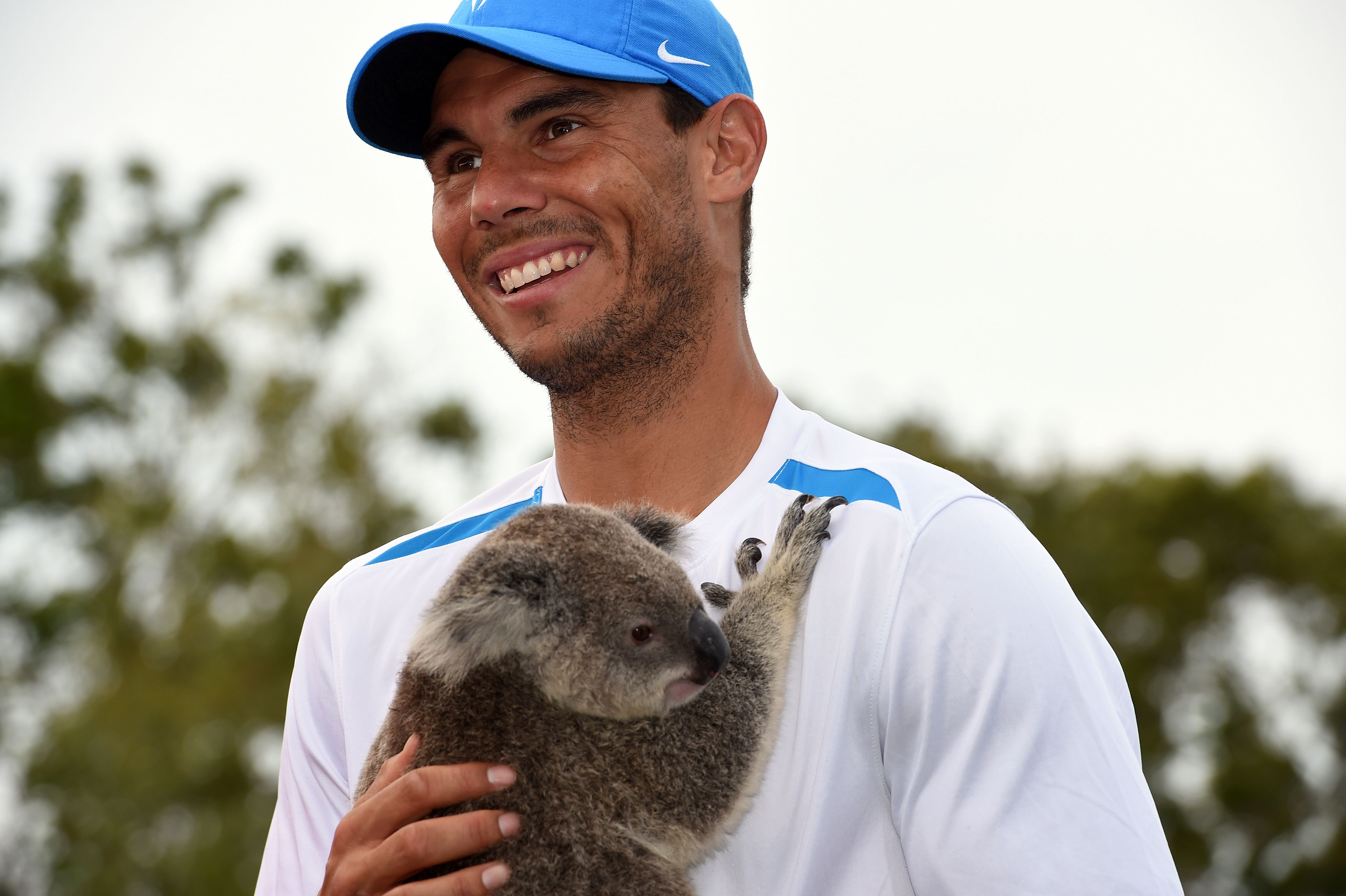 Here are some delightful photos of Rafael Nadal holding an adorable ...