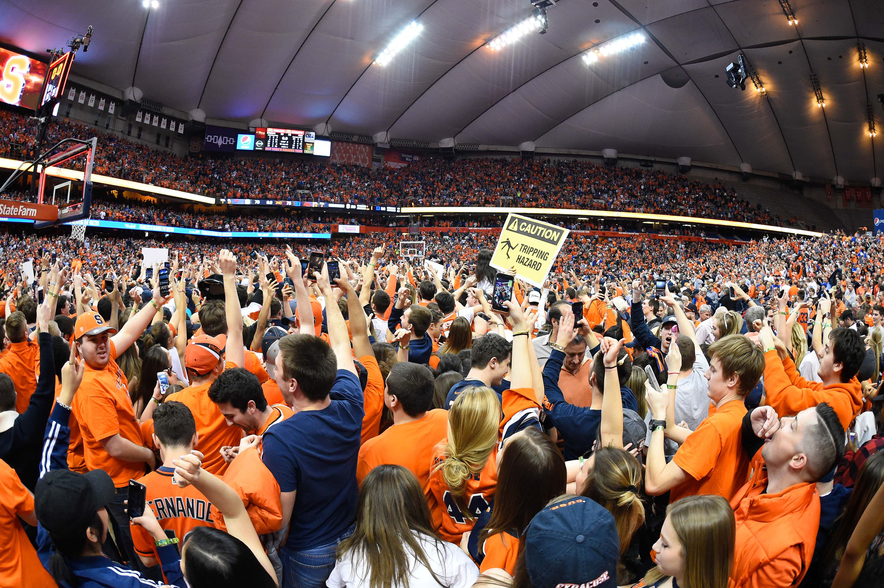 Feb 22, 2017; Syracuse, NY, USA; Syracuse Orange fans celebrate on the court following the game against the Duke Blue Devils at the Carrier Dome. The Orange won 78-75. Mandatory Credit: Rich Barnes-USA TODAY Sports ORG XMIT: USATSI-336548 ORIG FILE ID:  20170222_gma_ai8_080.jpg