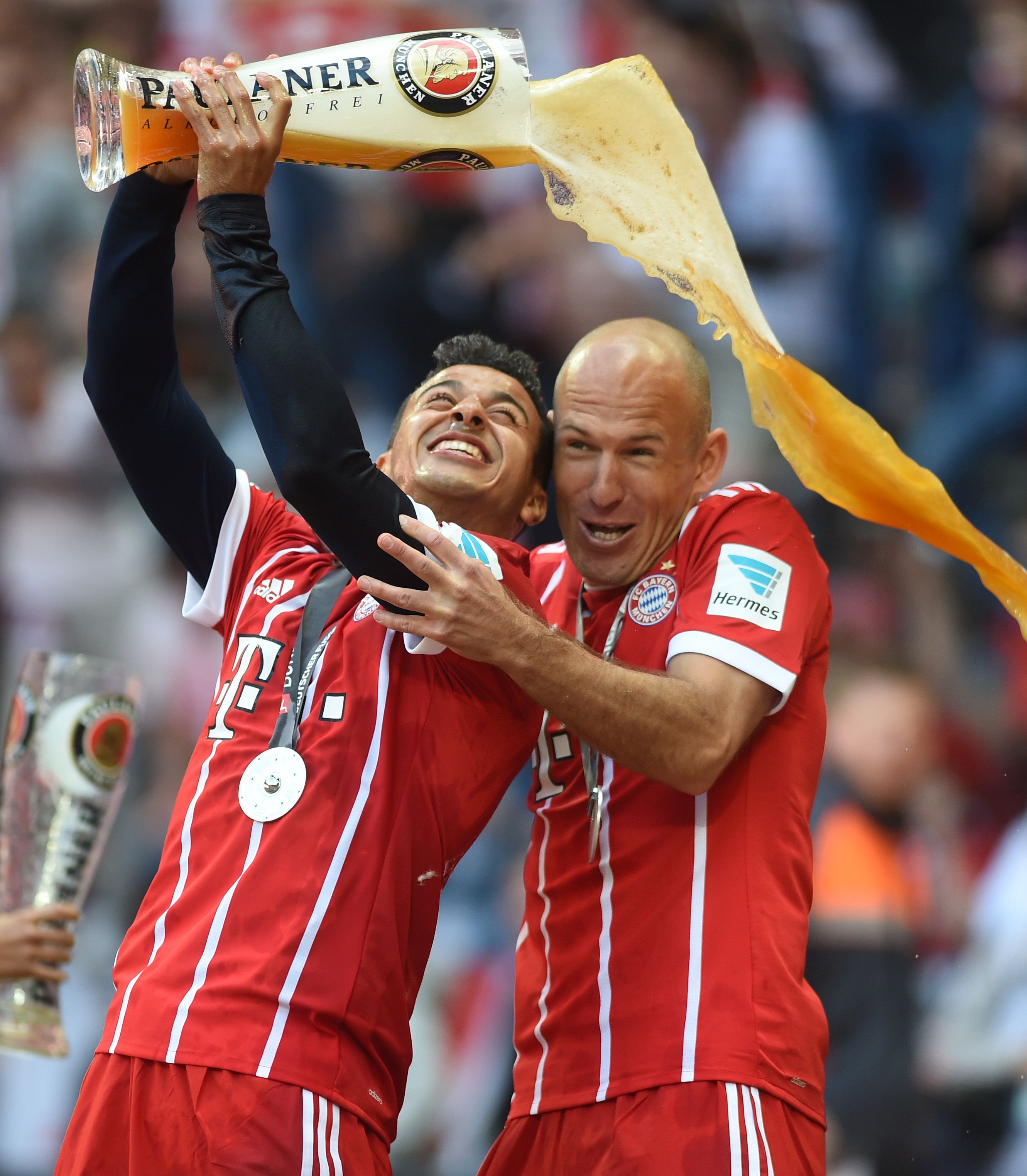 Arjen Robben poured a stein of beer on a reporter during ...