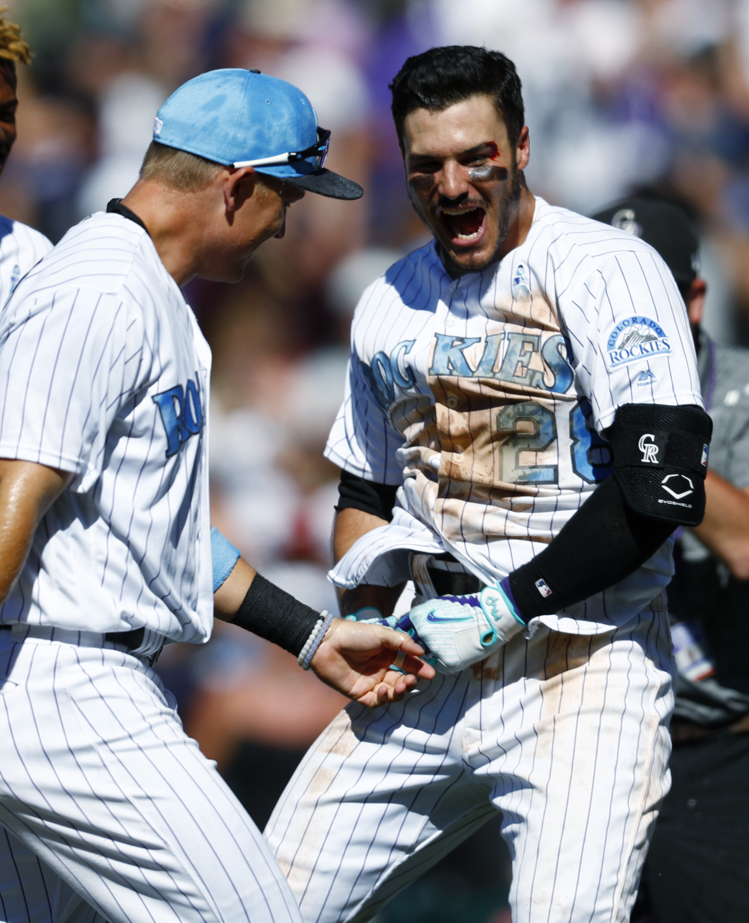 The Rockies basically beat up Nolan Arenado in a bloody walk-off cycle  celebration