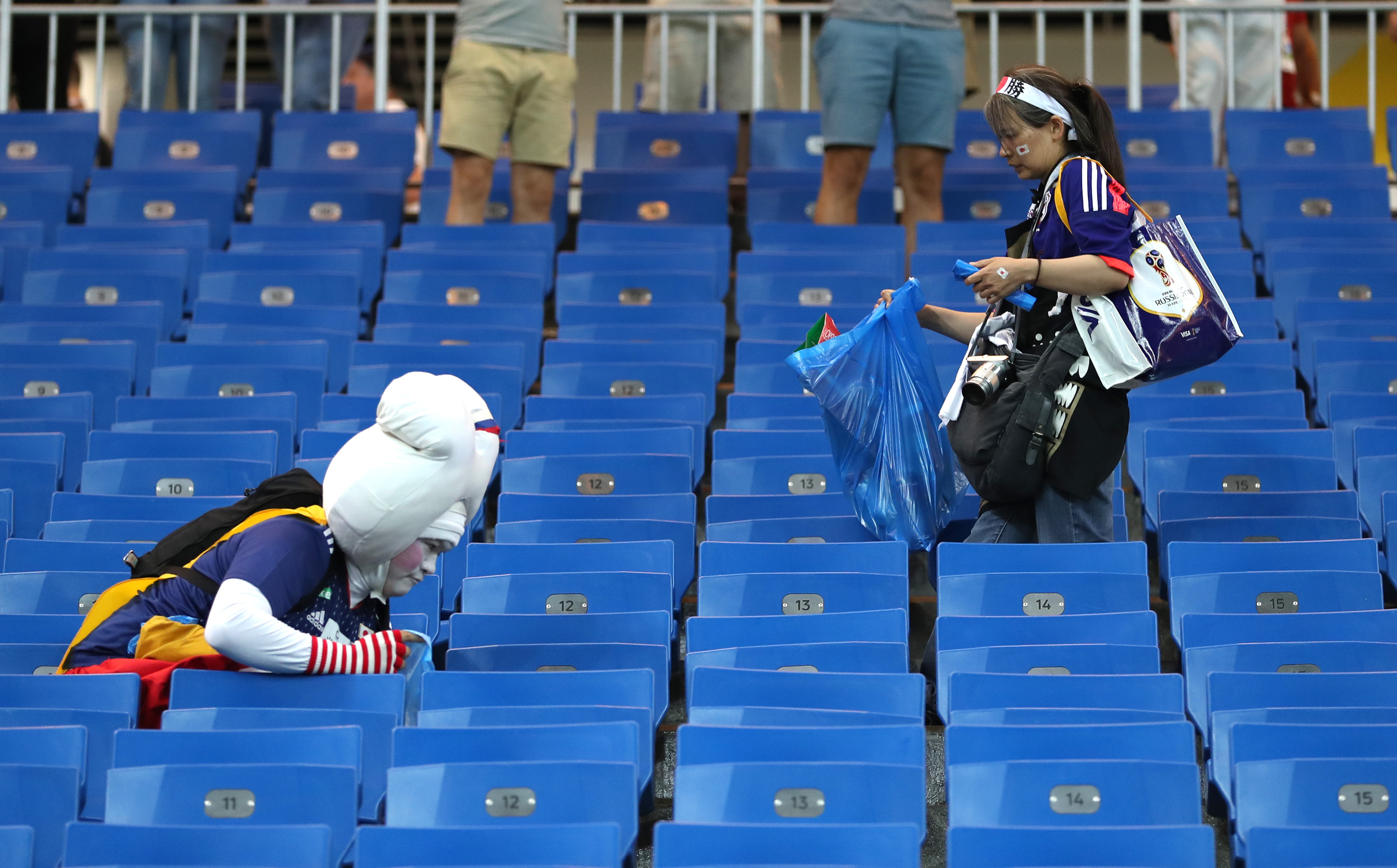 Japan's World Cup fans cleaned up the stadium after they won. Now others  are doing it. - Vox