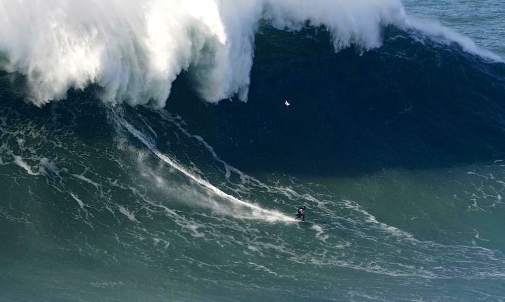 Surfer at Nazare rides estimated 100foot wave; might be a world record