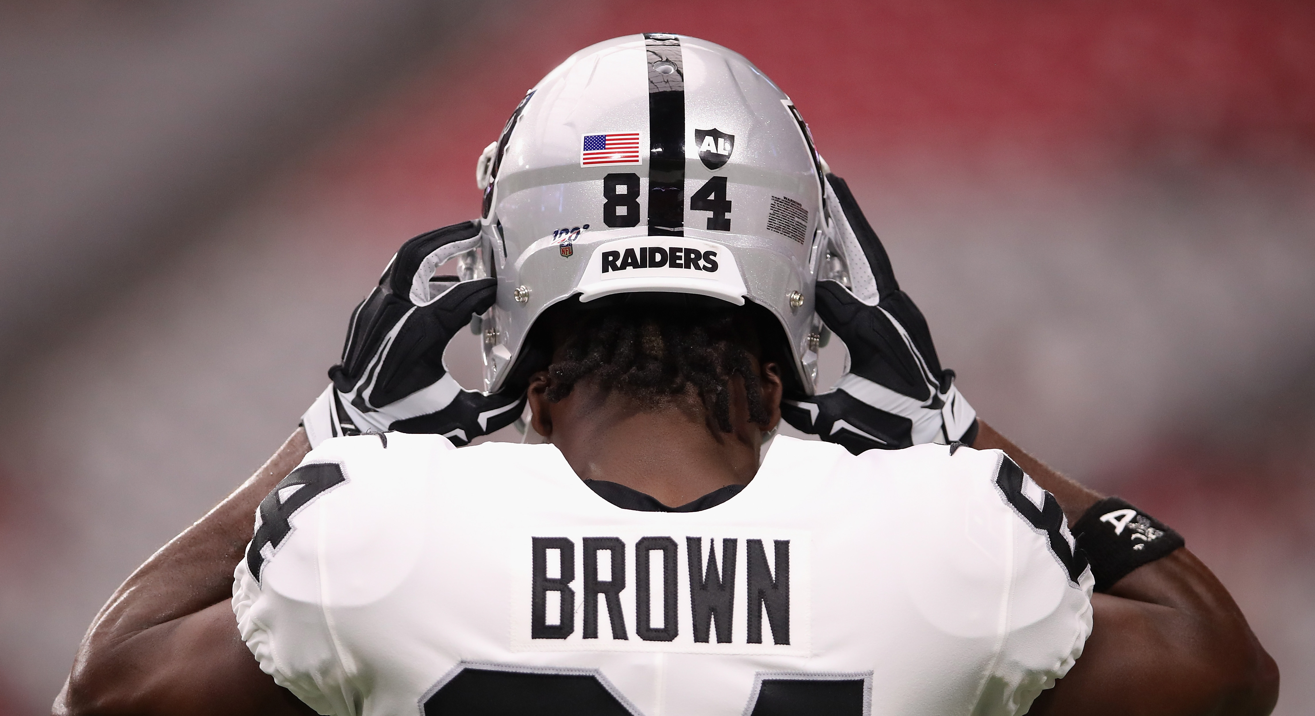 Gruden says Brown 'all-in' after practicing in certified helmet