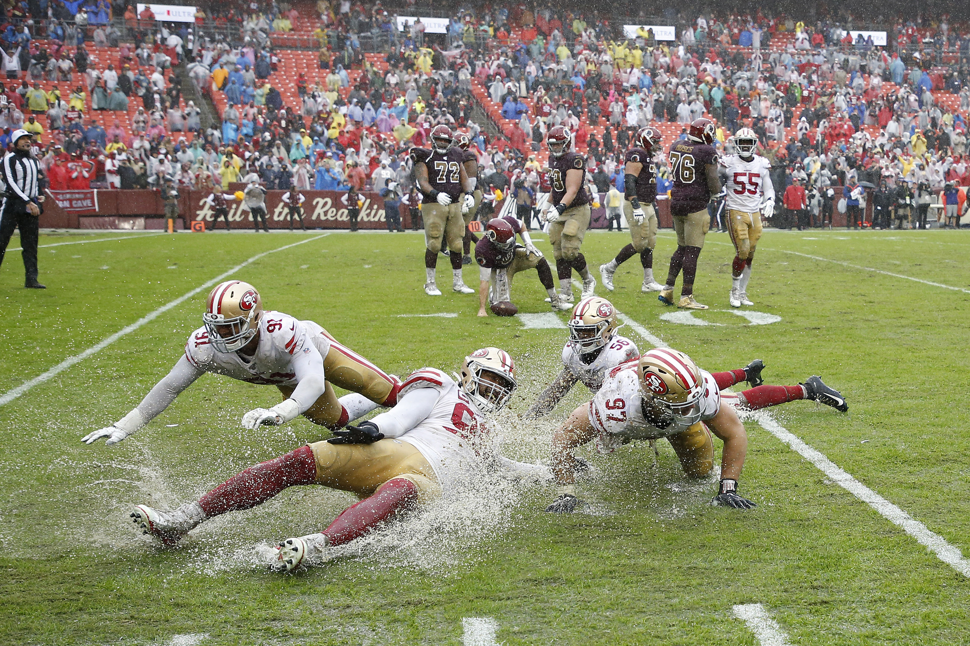 Drenching rain turns 49ers game into giant slip-n-slide