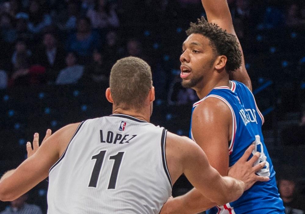 Oct 18, 2015; Brooklyn, NY, USA; Philadelphia 76ers center Jahlil Okafor (8) looks to pass the ball with Brooklyn Nets center Brook Lopez (11) defending during the 2nd qtr at Barclays Center. Mandatory Credit: Gregory J. Fisher-USA TODAY Sports
