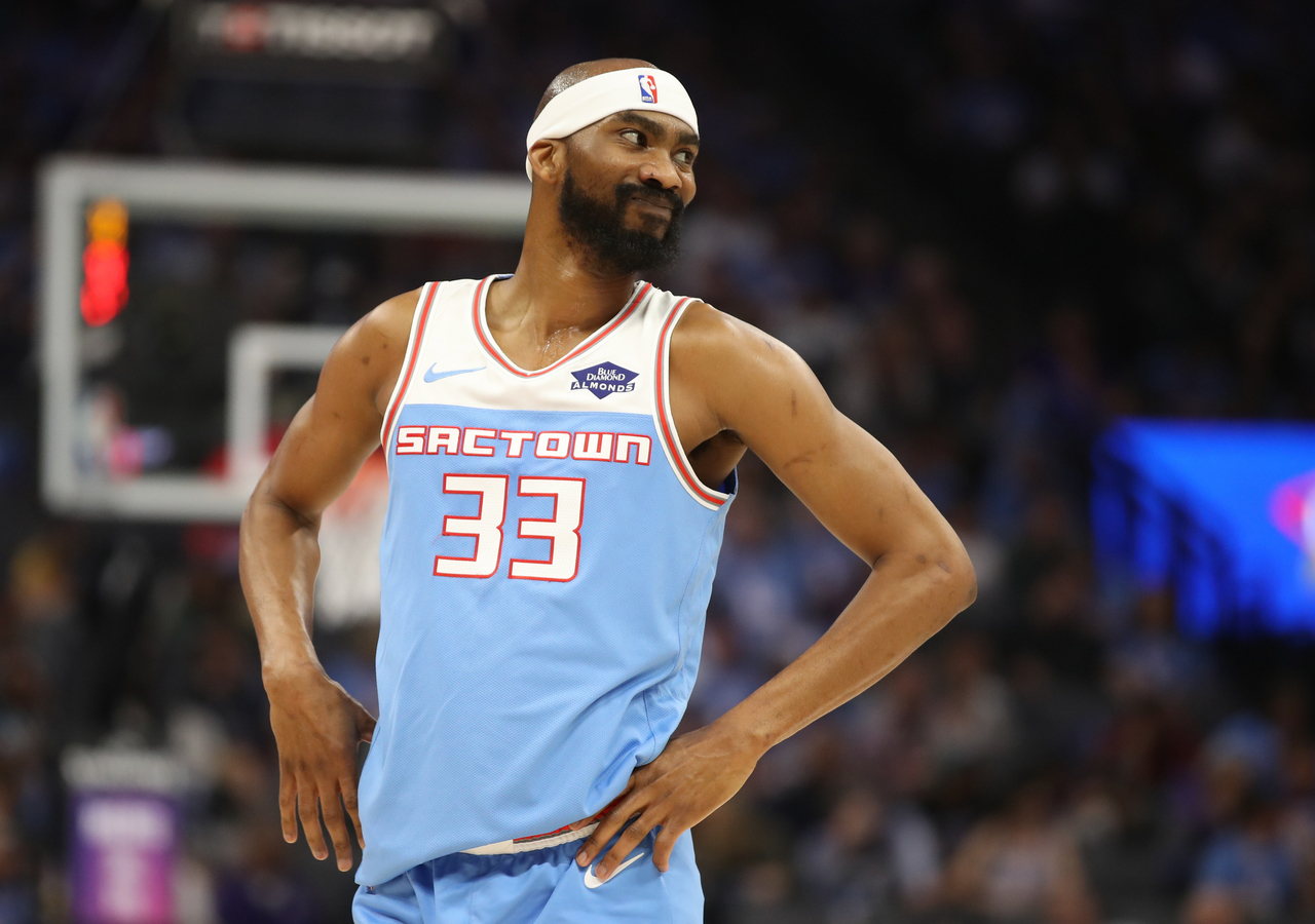 Corey Brewer smiles after a play