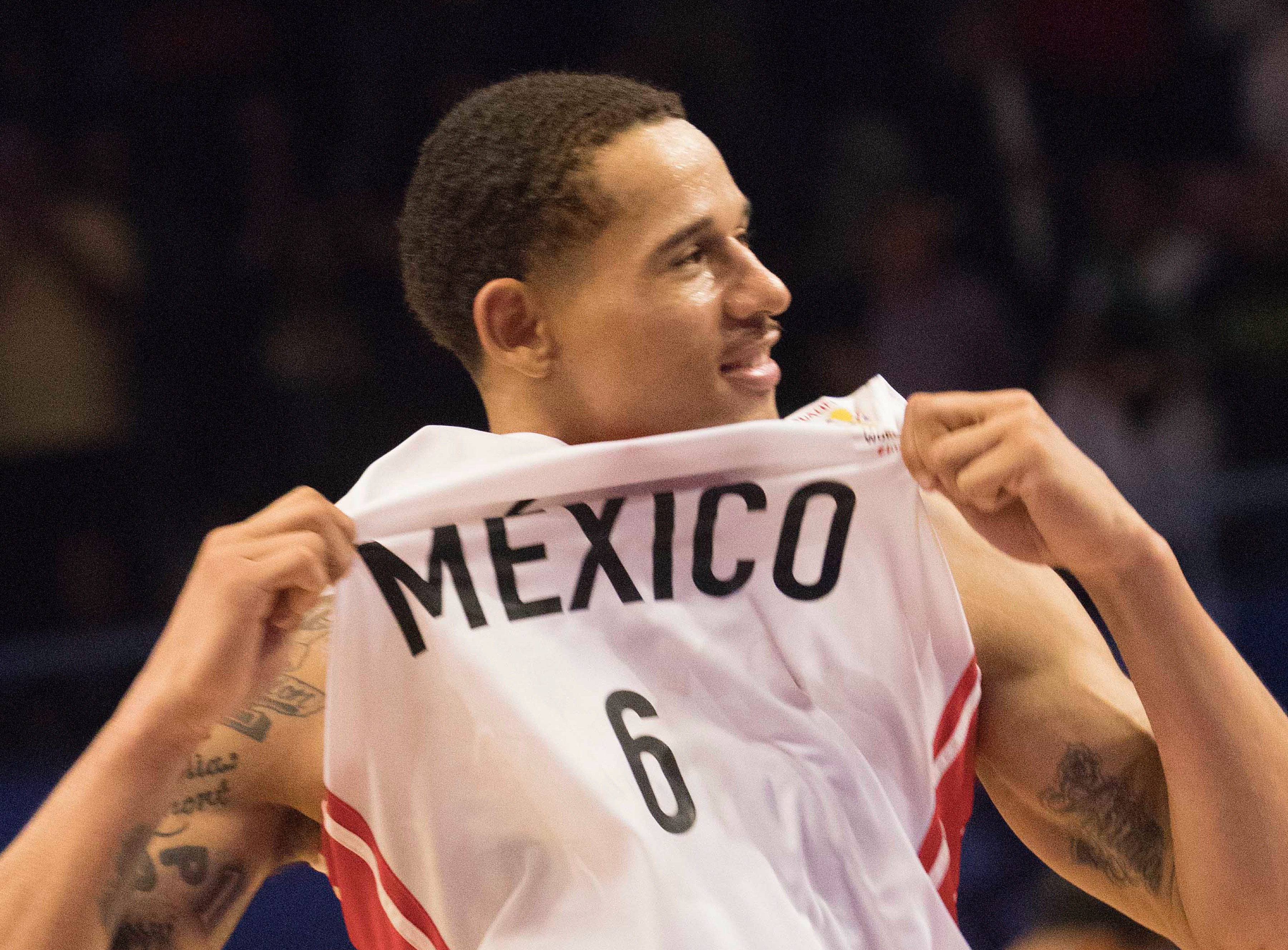 Mexico's Juan Toscano celebrates his team's victory over the U.S. at a regular season FIBA basketball World Cup qualifier game in Mexico City, Thursday, June 28, 2018.