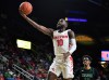 Feb 25, 2020; Fairfax, Virginia, USA; Dayton Flyers guard Jalen Crutcher (10) shoots as George Mason Patriots forward AJ Wilson (12) looks on during the first half at EagleBank Arena.