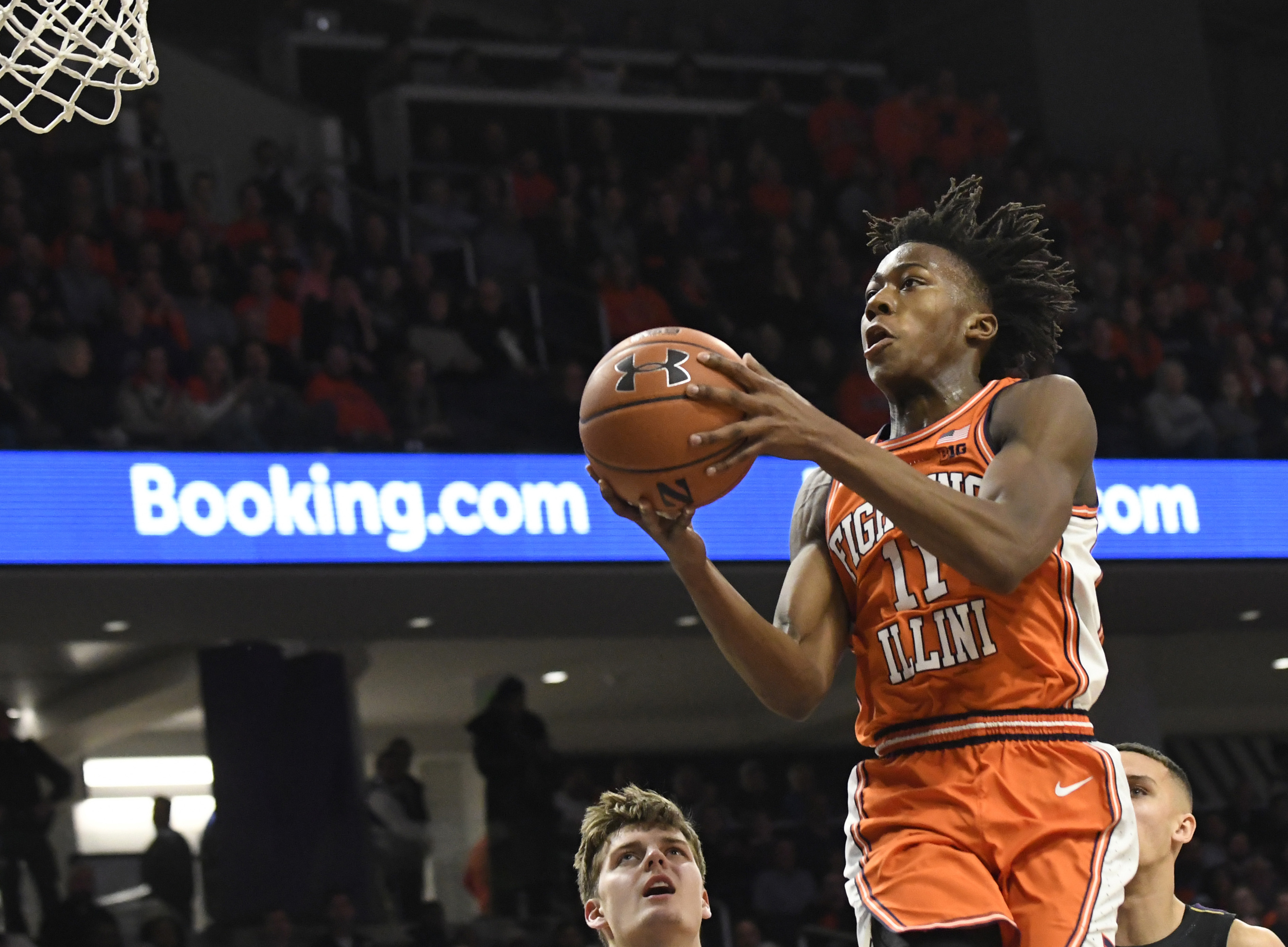 Feb 27, 2020; Evanston, Illinois, USA; Illinois Fighting Illini guard Ayo Dosunmu (11) goes to the basket against the Northwestern Wildcats during the first half at Welsh-Ryan Arena.