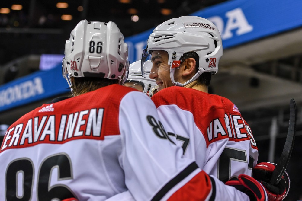Mar 18, 2018; Brooklyn, NY, USA; Carolina Hurricanes defenseman Trevor van Riemsdyk (57) celebrates with Carolina Hurricanes left wing Teuvo Teravainen (86) after scoring a goal against the New York Islanders during the third period at Barclays Center. Mandatory Credit: Dennis Schneidler-USA TODAY Sports