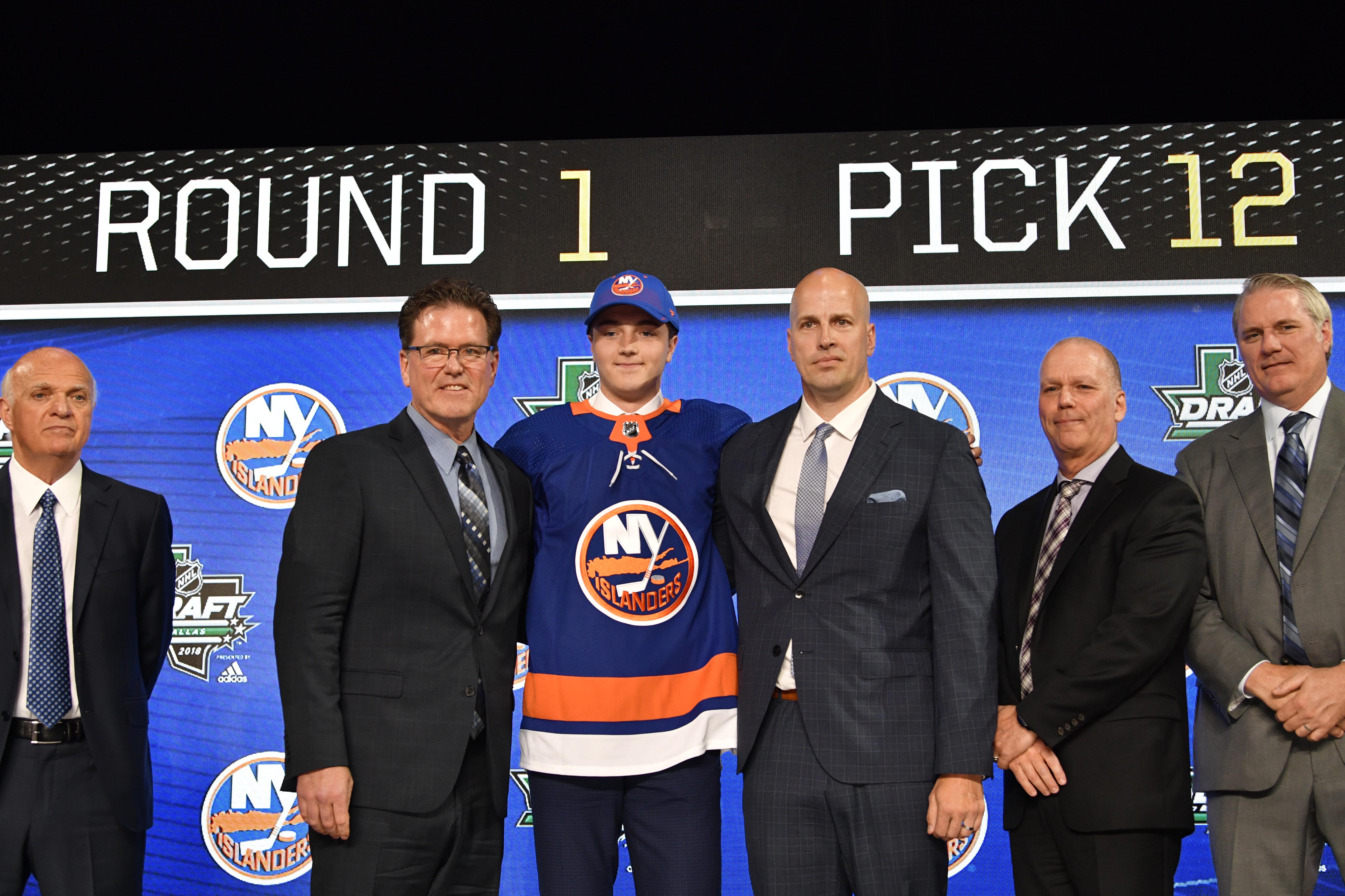 Jun 22, 2018; Dallas, TX, USA; Noah Dobson poses for a photo with team representatives after being selected as the number twelve overall pick to the New York Islanders in the first round of the 2018 NHL Draft at American Airlines Center. Mandatory Credit: Jerome Miron-USA TODAY Sports