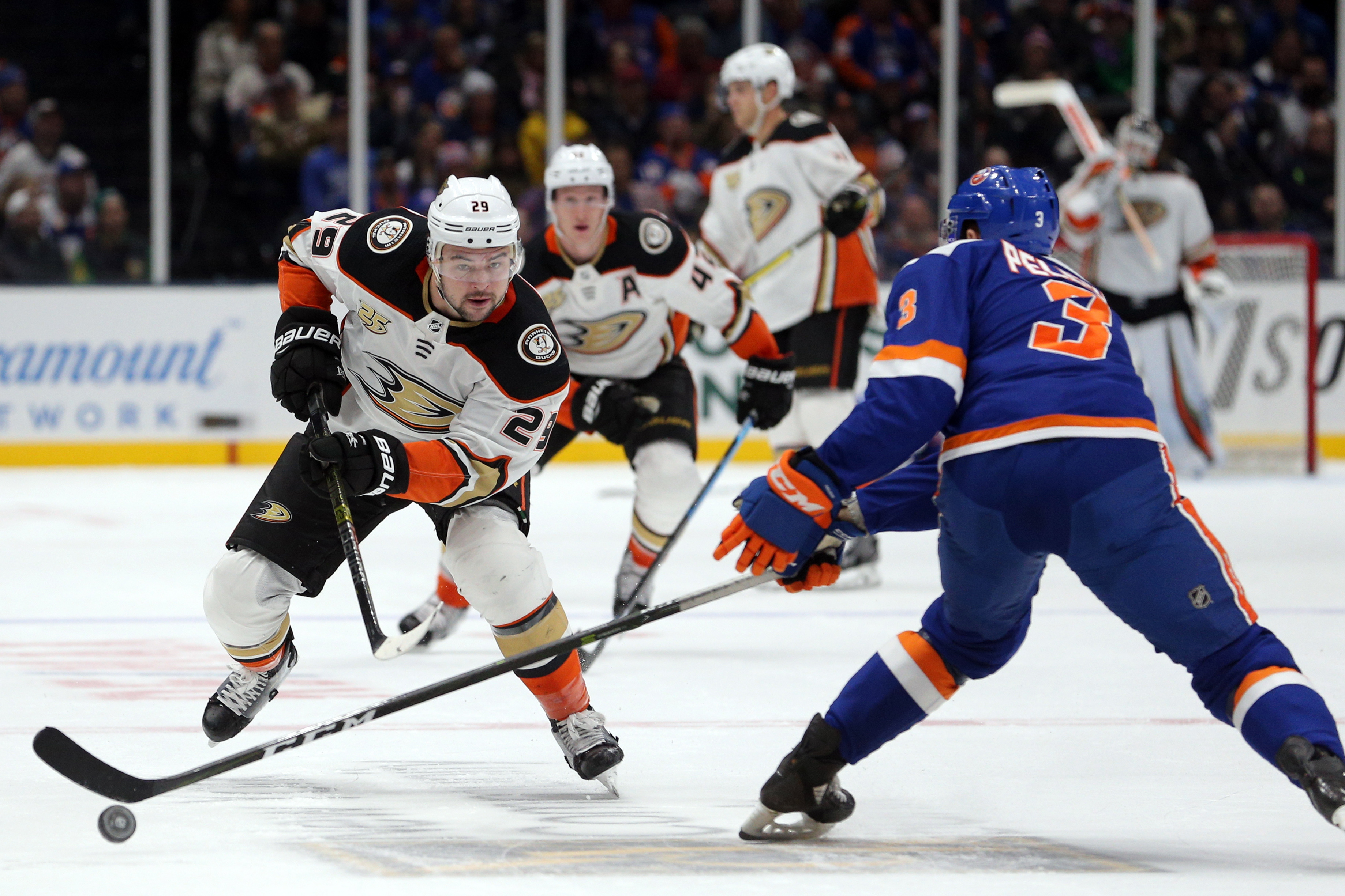 Jan 20, 2019; Uniondale, NY, USA; Anaheim Ducks center Devin Shore (29) plays the puck against New York Islanders defenseman Adam Pelech (3) during the first period at Nassau Veterans Memorial Coliseum. Mandatory Credit: Brad Penner-USA TODAY Sports