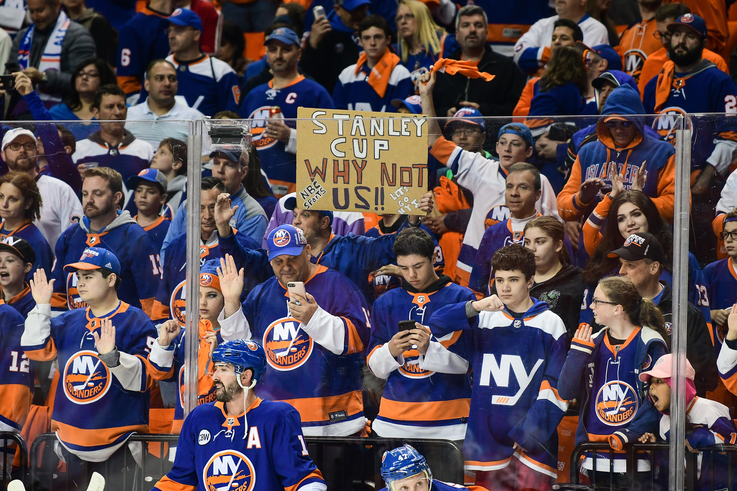Apr 26, 2019; Brooklyn, NY, USA; Islanders fans holding a sign during warmups during a game between the New York Islanders and Carolina Hurricanes in game one of the second round of the 2019 Stanley Cup Playoffs at Barclays Center. Mandatory Credit: Catalina Fragoso-USA TODAY Sports