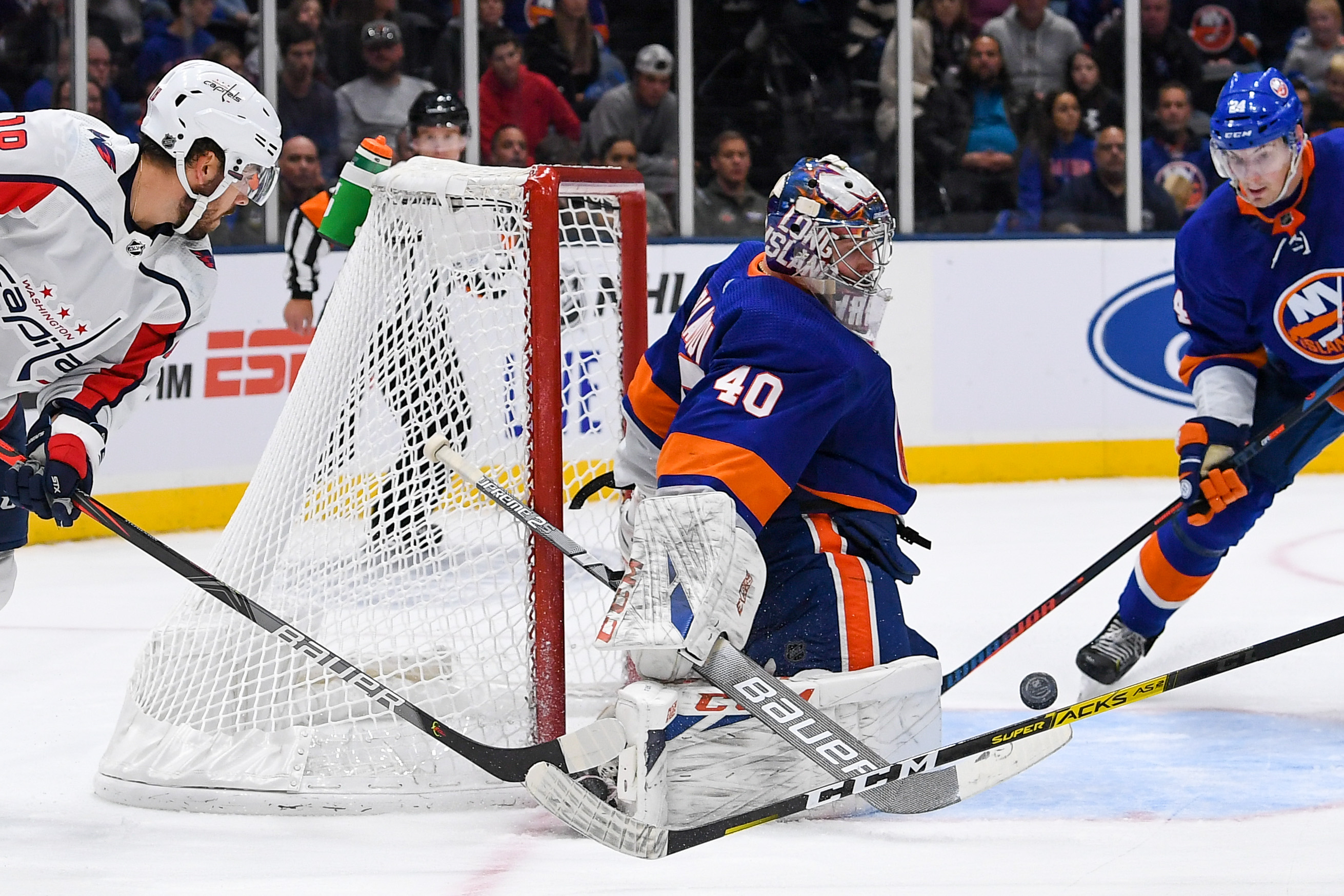 Oct 4, 2019; Uniondale, NY, USA; New York Islanders goaltender Semyon Varlamov (40) makes a save on an attempted wrap around by Washington Capitals center Chandler Stephenson (18) during the third period at Nassau Veterans Memorial Coliseum. Mandatory Credit: Dennis Schneidler-USA TODAY Sports