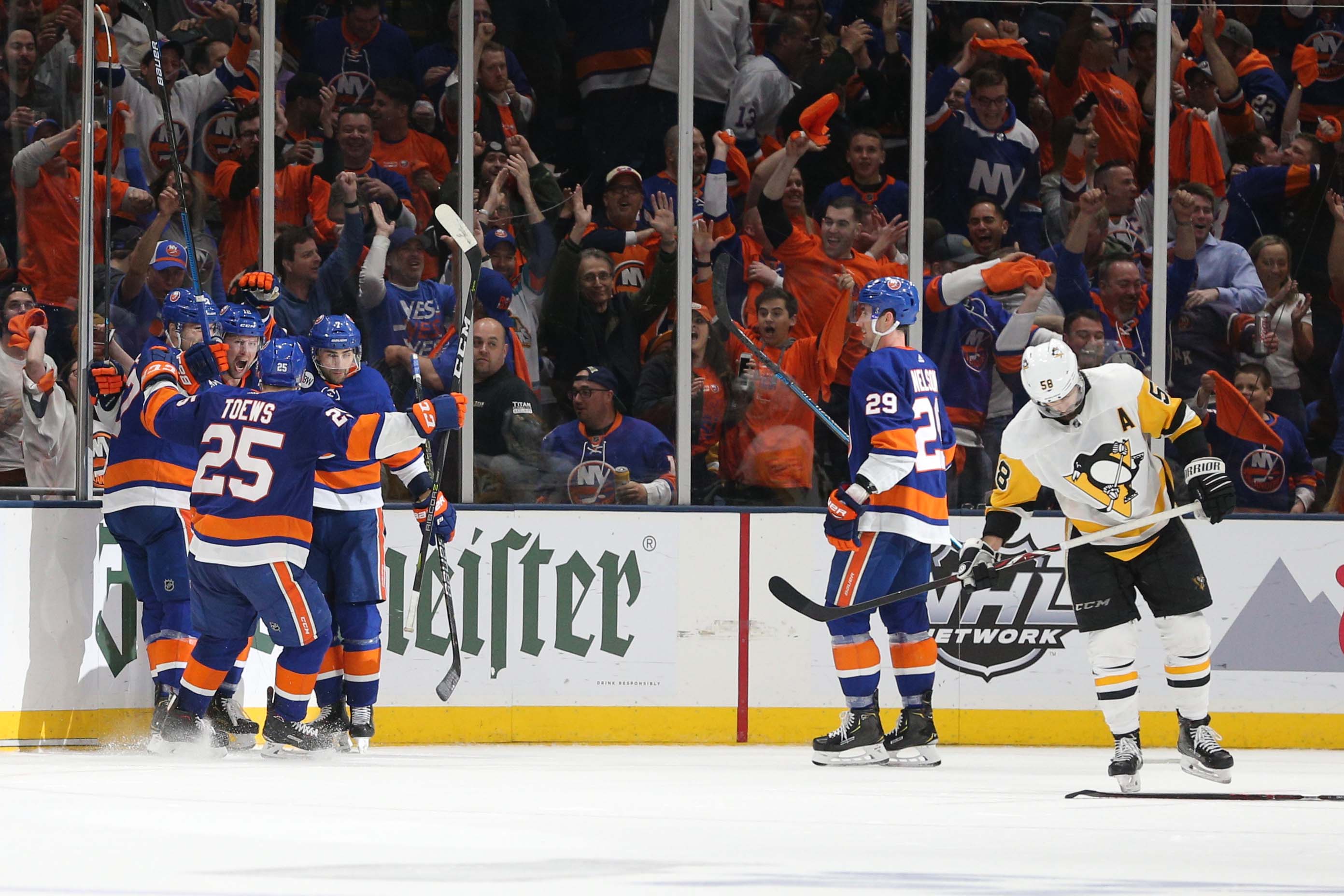 Apr 12, 2019; Uniondale, NY, USA; New York Islanders left wing Josh Bailey (12) celebrates his goal against the Pittsburgh Penguins with teammates during the third period of game two of the first round of the 2019 Stanley Cup Playoffs at Nassau Veterans Memorial Coliseum. Mandatory Credit: Brad Penner-USA TODAY Sports