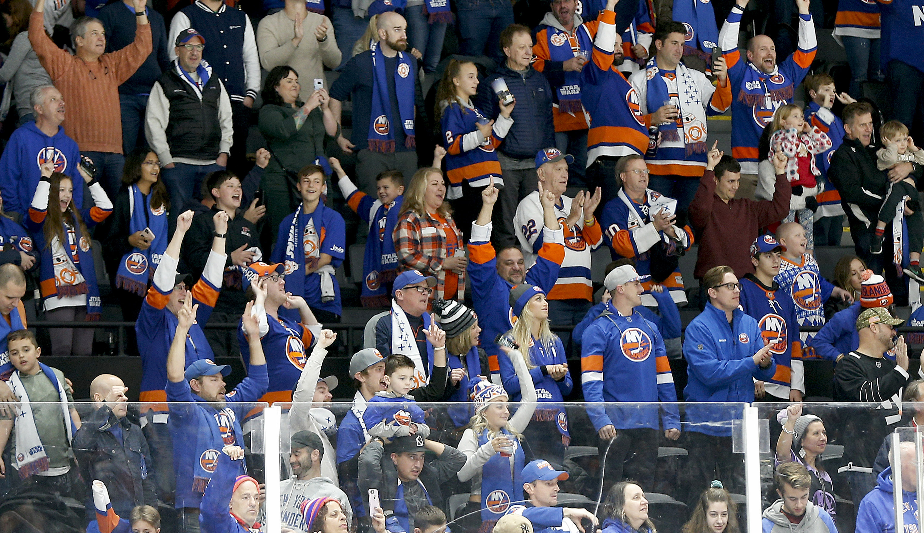 Dec 14, 2019; Uniondale, NY, USA; Islanders fans react after the New York Islanders defeated the Buffalo Sabres at Nassau Veterans Memorial Coliseum. Mandatory Credit: Andy Marlin-USA TODAY Sports