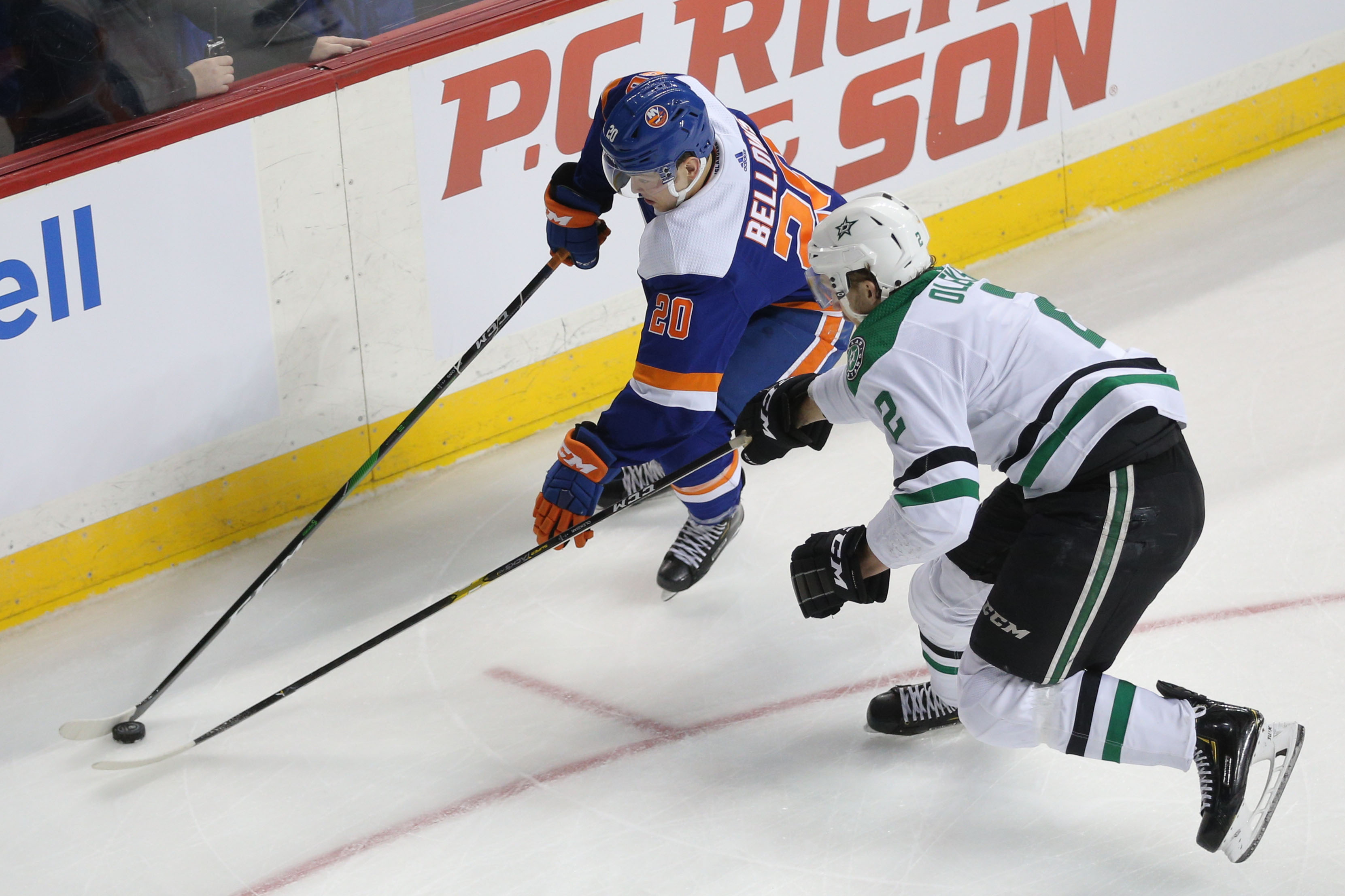 Feb 4, 2020; Brooklyn, New York, USA; New York Islanders left wing Kieffer Bellows (20) plays the puck against Dallas Stars defenseman Jamie Oleksiak (2) during the second period at Barclays Center. Mandatory Credit: Brad Penner-USA TODAY Sports