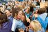 Mercy Academy Jaguars' middle blocker Alexandra Hamrick, center, and her teammates are swarmed with hugging fans, friends and family members moments after Mercy won the state volleyball championship. (By David R. Lutman / Special to The Courier-Journal)