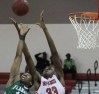 Zach Brown (right,) from Miami Beach High, battles Randall Ferdinand from Flanagan for a rebound. 