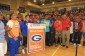 The Bishop Gorman football team and former coach Tony Sanchez accept the Super 25 championship banner (Photo: Bishop Gorman)