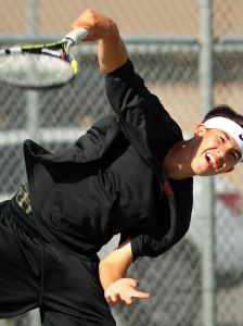 Palm Desert's Alex Kuperstein serves the ball to Indio's Eleazer Vazquez during a boys varsity tennis match on Tuesday, April 7, 2015 at Indio High School. (Photo: Crystal Chatham/The Desert Sun)