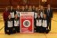 The Hoxie girls basketball team displays its banner for winning the Best Girls Basketball Program contest (Photo: Hoxie High School)