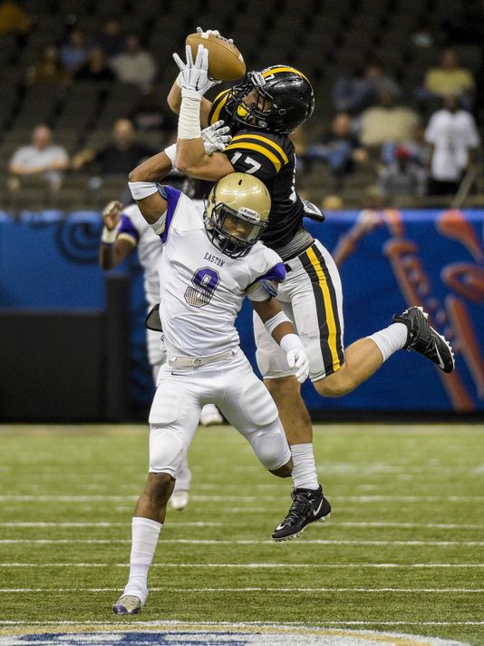 Neville wide receiver Chris Fuller (17) makes a catch over a Warren Easton defender during the 2014 Class 4A state championship game. (Photo: Monroe News-Star)
