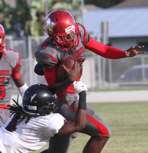 South Fort Myers' Riley Ware attempts to stop North Fort Myers' Zaquandre White during a pre-season game at North Fort Myers HIgh School on Thursday. (Photo: Jack Hardman/The News-Press)