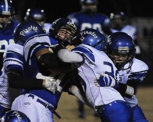 North Harrison's Sam Best (left) gains yardage before being tackled by Charlestown on Friday at North Harrison High School. (By David Lee Hartlage, Special to the C-J) Nov. 7, 2014.