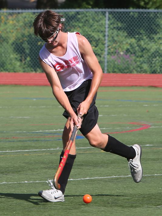 From left, Rye's Sean Walsh moves the ball up the field during field hockey practice at Rye High School on Aug. 20, 2015. (Photo: Frank Becerra Jr., The Journal News)