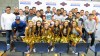 Cohl Cabral is surrounded by his fellow seniors on the football team and the school's cheerleaders (Photo: Intersport)
