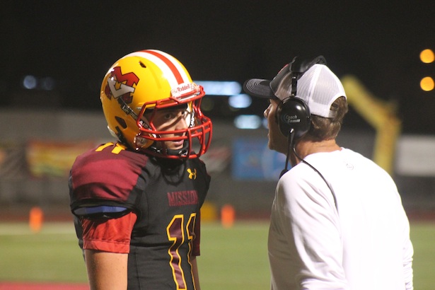 Brock Johnson talks with his dad and coach during a 2014 game. (Photo: OCsidelines.com)